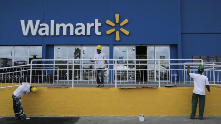 Workers are working to prepare a new Walmart store for an inauguration in the city of Recife, in northeastern Brazil, on December 6, 2017. The Brazilian unit of Wal-Mart Stores has decided to integrate its physical retail and e-commerce activities along with a campaign to renovate its stores, the company said on Tuesday. (Photo by Diego Herculano/NurPhoto via Getty Images)