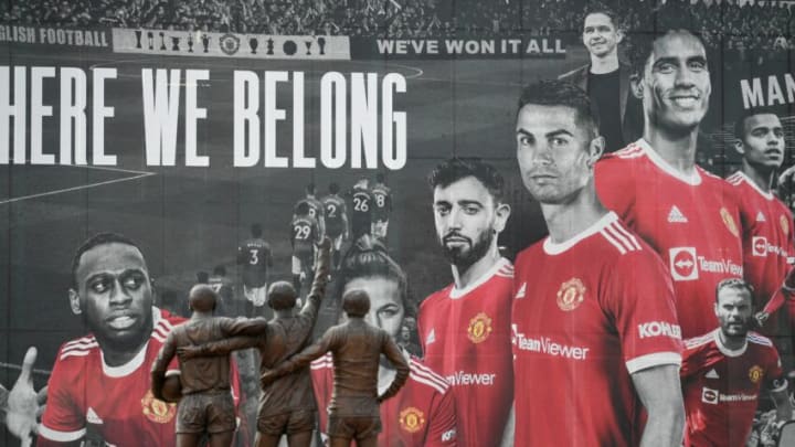 Manchester United's new signing Cristiano Ronaldo appears on a banner covering part of the exterior of Old Trafford stadium in Manchester, northwest England on September 10, 2021. (Photo by Oli SCARFF / AFP) (Photo by OLI SCARFF/AFP via Getty Images)