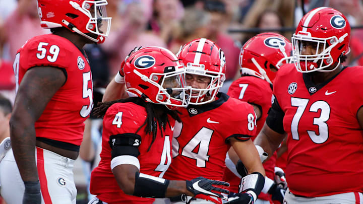 Georgia running back James Cook (4) celebrates with his teammates after scoring a touchdown during the first half of an NCAA college football game between South Carolina and Georgia in Athens, Ga., on Sept. 18, 2021.News Joshua L Jones