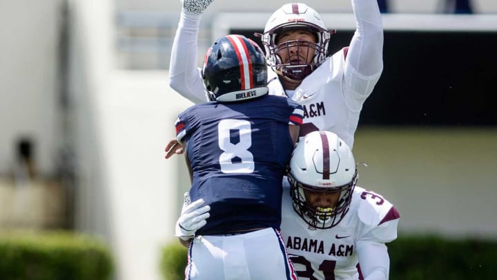 Alabama A&M’s defense tries to stop Jackson State University’s quarterback Quincy Casey (8) during their game at Veterans Memorial Stadium in Jackson, Miss., Saturday, April 10, 2021.1357