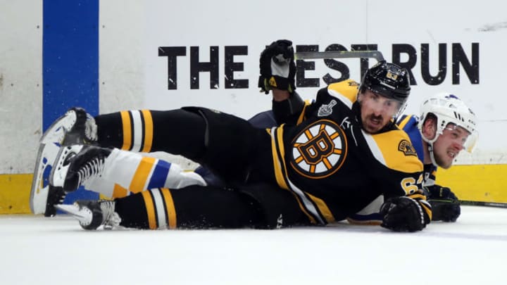 BOSTON, MASSACHUSETTS - JUNE 06: Brad Marchand #63 of the Boston Bruins and Vladimir Tarasenko #91 of the St. Louis Blues get tangled up during the third period in Game Five of the 2019 NHL Stanley Cup Final at TD Garden on June 06, 2019 in Boston, Massachusetts. (Photo by Bruce Bennett/Getty Images)