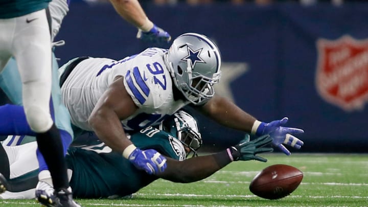 Oct 30, 2016; Arlington, TX, USA; Dallas Cowboys defensive tackle Terrell McClain (97) tries to recover a fumble by Philadelphia Eagles running back Wendell Smallwood (28) in the game at AT&T Stadium. Dallas Cowboys won 29-23. Mandatory Credit: Tim Heitman-USA TODAY Sports