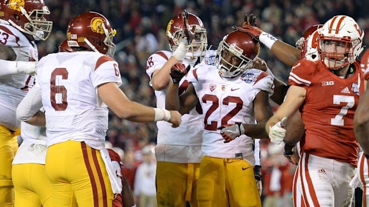 Dec 30, 2015; San Diego, CA, USA; USC Trojans running back Justin Davis (22) is congratulated after scoring against the Wisconsin Badgers during the second quarter in the 2015 Holiday Bowl at Qualcomm Stadium. Mandatory Credit: Jake Roth-USA TODAY Sports