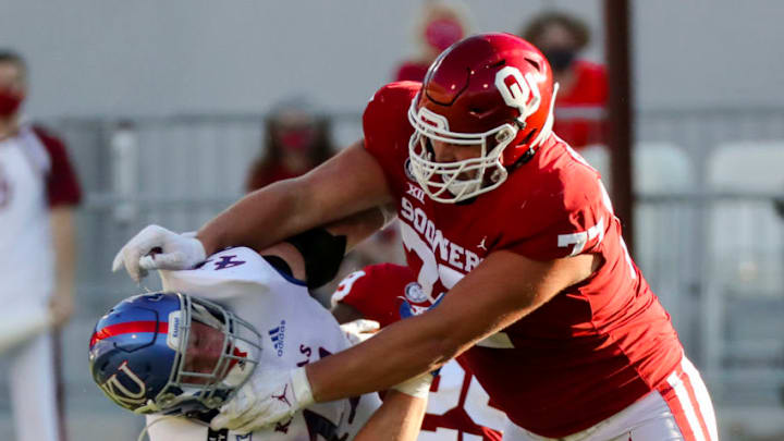 Nov 7, 2020; Norman, Oklahoma, USA; Oklahoma Sooners offensive lineman Erik Swenson (77) blocks Kansas Jayhawks linebacker Nick Channel (41) during the first half at Gaylord Family-Oklahoma Memorial Stadium. Mandatory Credit: Kevin Jairaj-USA TODAY Sports