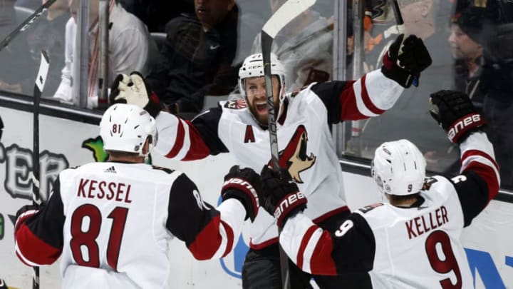 ANAHEIM, CA - OCTOBER 3: Derek Stepan #21 of the Arizona Coyotes celebrates his goal with his teammates Phil Kessel #81 and Clayton Keller #9 in the second period of the game against the Anaheim Ducks at Honda Center on October 3, 2019 in Anaheim, California. (Photo by Debora Robinson/NHLI via Getty Images)