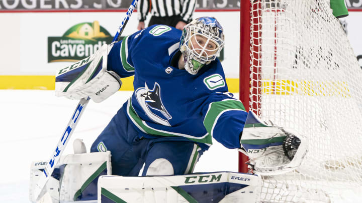 Thatcher Demko makes a save for the Vancouver Canucks (Photo by Rich Lam/Getty Images).