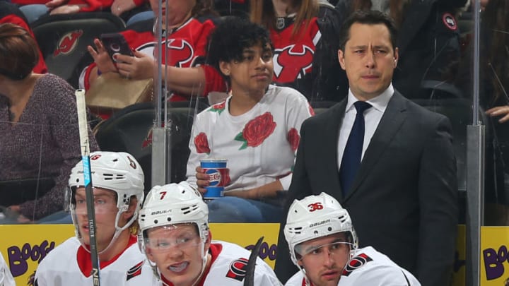 NEWARK, NJ - DECEMBER 21: Guy Boucher head coach of the Ottawa Senators looks on from the bench during the first period against the New Jersey Devils at the Prudential Center on December 21, 2018 in Newark, New Jersey. (Photo by Andy Marlin/NHLI via Getty Images)