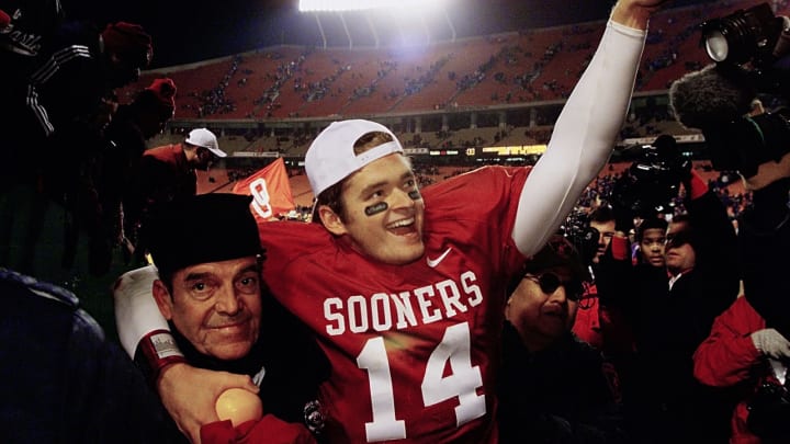 02 Dec 2000: Quarterback Josh Heupel #14 of the Oklahoma Sooners celebrates with an orange in hand after defeating the Kansas State Wildcats 27-24 during the Big 12 Championship at Arrowhead Stadium in Kansas City, Missouri. Oklahoma will play for the national championship at the Orange Bowl. Mandatory Credit: Brian Bahr/ALLSPORT