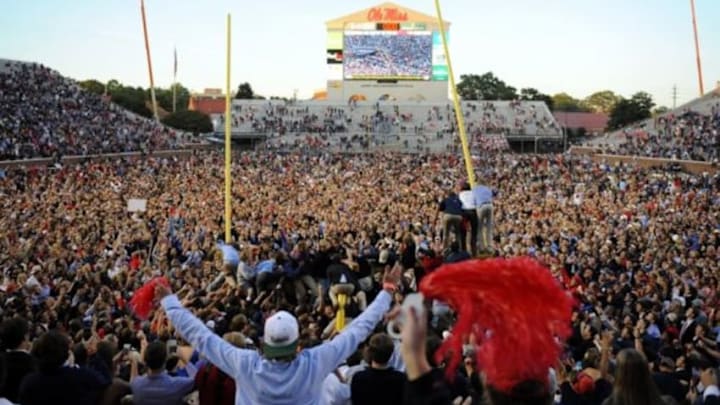 Oct 4, 2014; Oxford, MS, USA; Mississippi Rebels fans tear down the goal posts after a win against the Alabama Crimson Tide at Vaught-Hemingway Stadium. The Rebels won 23-17. Mandatory Credit: Christopher Hanewinckel-USA TODAY Sports