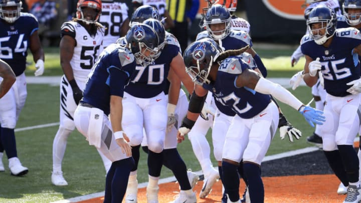 CINCINNATI, OHIO - NOVEMBER 01: Quarterback Ryan Tannehill #17, running back Derrick Henry #22 and their Tennessee Titans teammates celebrate a touchdown against the Cincinnati Bengals in the end zone in the second quarter of the game at Paul Brown Stadium on November 01, 2020 in Cincinnati, Ohio. (Photo by Andy Lyons/Getty Images)