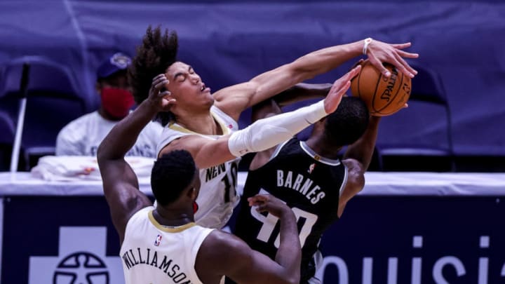 Feb 1, 2021; New Orleans, Louisiana, USA; New Orleans Pelicans center Jaxson Hayes (10) fouls Sacramento Kings forward Harrison Barnes (40) going for a block during the second half at the Smoothie King Center. Mandatory Credit: Stephen Lew-USA TODAY Sports