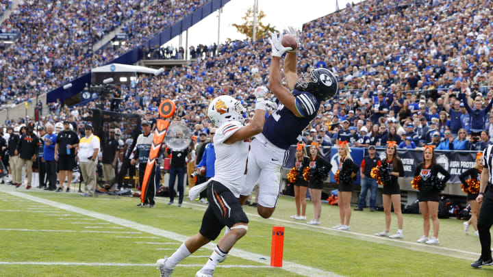 Nov 6, 2021; Provo, Utah, USA; Brigham Young Cougars wide receiver Puka Nacua (12) grabs a reception for a touchdown against Idaho State Bengals defensive back Jayden Dawson (2) in the second quarter at LaVell Edwards Stadium. Mandatory Credit: Jeffrey Swinger-USA TODAY Sports