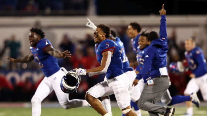 Kansas football Wide receiver Stephon Robinson Jr. #5 and the Kansas Jayhawks storm the field. (Photo by Jamie Squire/Getty Images)