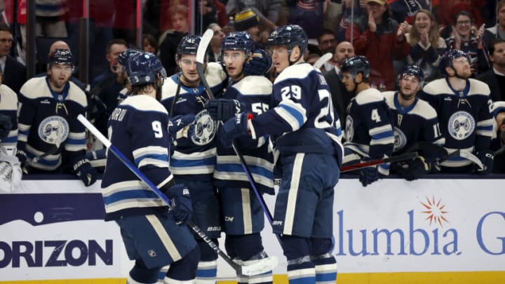 COLUMBUS, OHIO - OCTOBER 14: David Jiricek #55 of the Columbus Blue Jackets is congratulated by his teammates after scoring his first career NHL goal during the second period of the game against the New York Rangers at Nationwide Arena on October 14, 2023 in Columbus, Ohio. (Photo by Kirk Irwin/Getty Images)