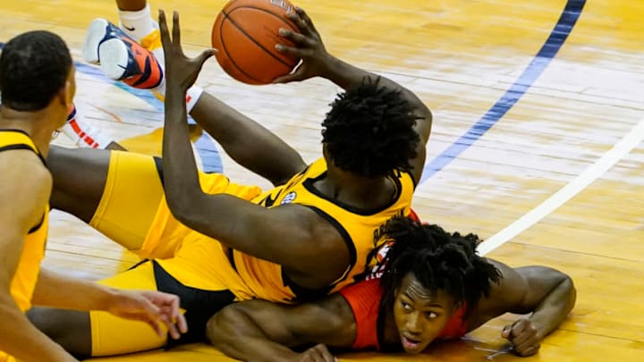 Dec 12, 2020; Columbia, Missouri, USA; Missouri Tigers forward Kobe Brown (24) grabs a loose ball against Illinois Fighting Illini guard Ayo Dosunmu (11) during the second half at Mizzou Arena. Mandatory Credit: Jay Biggerstaff-USA TODAY Sports