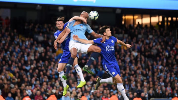 MANCHESTER, ENGLAND - MAY 06: Vincent Kompany of Manchester City battles for possession with Ben Chilwell of Leicester City and Harry Maguire of Leicester City during the Premier League match between Manchester City and Leicester City at Etihad Stadium on May 06, 2019 in Manchester, United Kingdom. (Photo by Laurence Griffiths/Getty Images)
