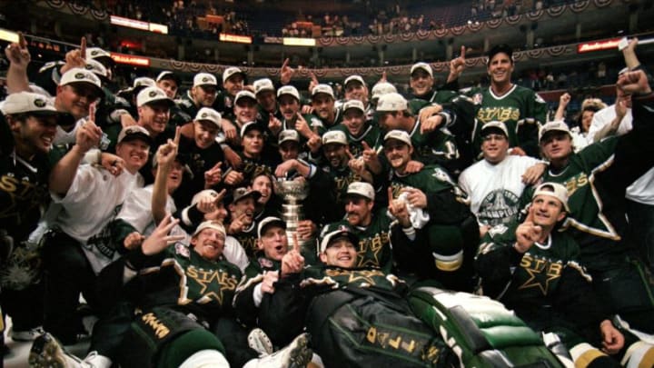 19 Jun 1999: The Dallas Stars pose for a team photo with the Stanely Cup trophy as they celebrate the win over the Buffalo Sabres at the Marine Midland Arena in Buffalo, New York. The Dallas Stars defeated the Sabres 2-1 in the third overtime. Mandatory Credit: Elsa Hasch /Allsport