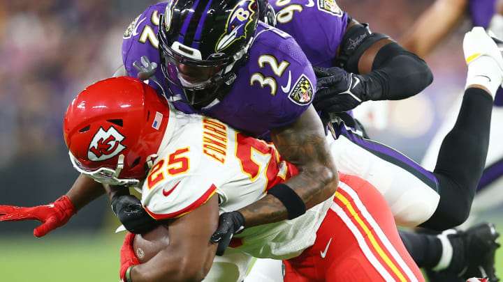 BALTIMORE, MARYLAND - SEPTEMBER 19: DeShon Elliott #32 of the Baltimore Ravens tackles Clyde Edwards-Helaire #25 of the Kansas City Chiefs during the first half at M&T Bank Stadium on September 19, 2021, in Baltimore, Maryland. (Photo by Todd Olszewski/Getty Images)