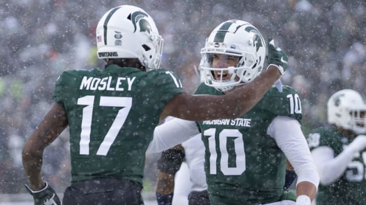 Nov 27, 2021; East Lansing, Michigan, USA; Michigan State Spartans quarterback Payton Thorne (10) celebrates with wide receiver Tre Mosley (17) after they connect for a touchdown during the first quarter against the Penn State Nittany Lions at Spartan Stadium. Mandatory Credit: Raj Mehta-USA TODAY Sports