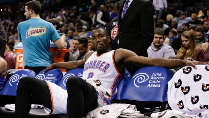 Jan 2, 2016; Charlotte, NC, USA; Oklahoma City Thunder forward Serge Ibaka (9) sits on the bench during the second half against the Charlotte Hornets at Time Warner Cable Arena. The Thunder defeated the Hornets 109-90. Mandatory Credit: Jeremy Brevard-USA TODAY Sports