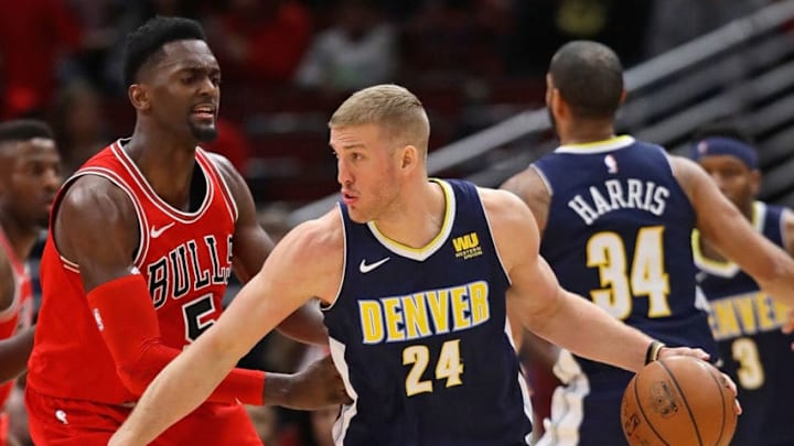 CHICAGO, IL - MARCH 21: Mason Plumlee #24 of the Denver Nuggets moves against Bobby Portis #5 of the Chicago Bulls at the United Center on March 21, 2018 in Chicago, Illinois. The Nuggets defeated the Bulls 135-102. NOTE TO USER: User expressly acknowledges and agrees that, by downloading and or using this photograph, User is consenting to the terms and conditions of the Getty Images License Agreement. (Photo by Jonathan Daniel/Getty Images)