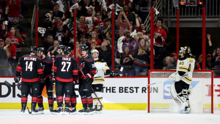 RALEIGH, NORTH CAROLINA - MAY 14: Calvin de Haan #44 of the Carolina Hurricanes celebrates with his teammates after scoring a goal on Tuukka Rask #40 of the Boston Bruins during the second period in Game Three of the Eastern Conference Finals during the 2019 NHL Stanley Cup Playoffs at PNC Arena on May 14, 2019 in Raleigh, North Carolina. (Photo by Bruce Bennett/Getty Images)