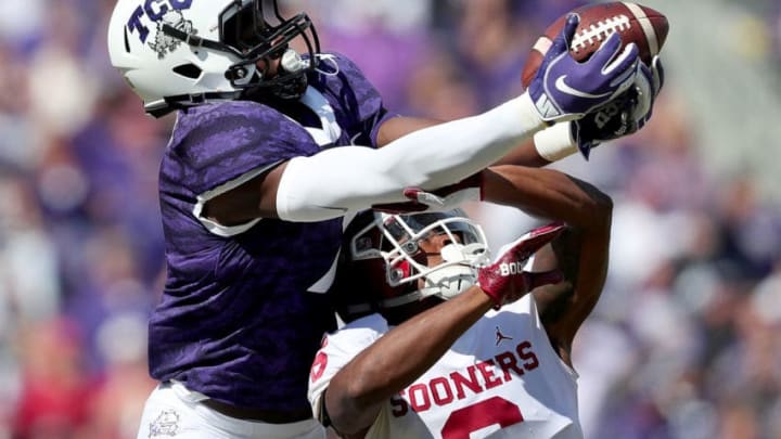 FORT WORTH, TX - OCTOBER 20: John Stephens Jr. #7 of the TCU Horned Frogs pulls in a pass against Tre Brown #6 of the Oklahoma Sooners in the second half at Amon G. Carter Stadium on October 20, 2018 in Fort Worth, Texas. (Photo by Tom Pennington/Getty Images)
