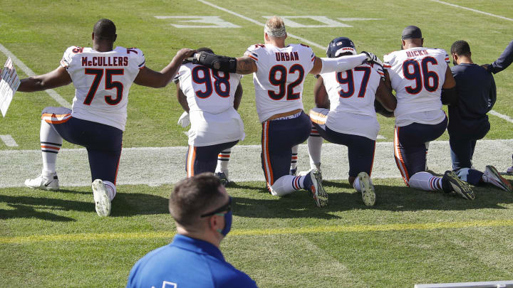 NASHVILLE, TENNESSEE – NOVEMBER 08: Dan McCullers #75, Bilal Nichols #98, Brent Urban #92, Mario Edwards #97, and Akiem Hicks #96 of the Chicago Bears kneel during the national anthem prior to against the Tennessee Titans at Nissan Stadium on November 08, 2020 in Nashville, Tennessee. (Photo by Frederick Breedon/Getty Images)