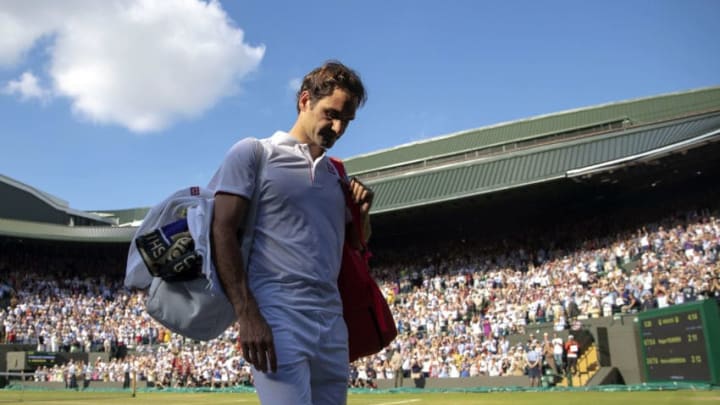 LONDON, ENGLAND - JULY 11: Roger Federer of Switzerland thanks the crowd after losing his Men's Singles Quarter-Finals match against Kevin Anderson of South Africa on day nine of the Wimbledon Lawn Tennis Championships at All England Lawn Tennis and Croquet Club on July 11, 2018 in London, England. Anderson won the match 6-2, 7-6, 5-7, 4-6, 11-13 in 4hr 13min. (Photo by Julian Finney/Getty Images)