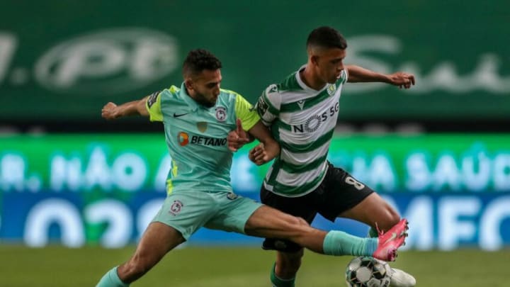 Sporting's Brazilian midfielder Matheus Nunes (R) vies with Maritimo´s French midfielder Rafik Guitane during the Portuguese league football match between Sporting Portugal and Maritimo Funchal at the Jose Alvalade stadium in Lisbon on May 19, 2021. (Photo by CARLOS COSTA / AFP) (Photo by CARLOS COSTA/AFP via Getty Images)