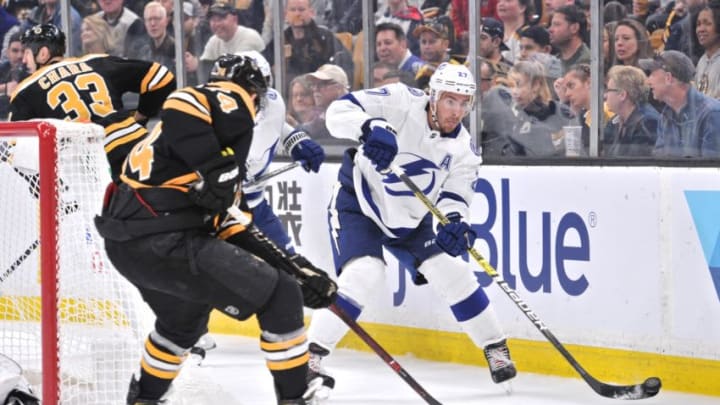 BOSTON, MA - APRIL 06: Tampa Bay Lightning Defenceman Ryan McDonagh (27) passes the puck off before Boston Bruins Left Wing Jake Debrusk (74) can steal it. During the Tampa Bay Lightning game against the Boston Bruins on April 06, 2019 at TD Garden in Boston, MA. (Photo by Michael Tureski/Icon Sportswire via Getty Images)