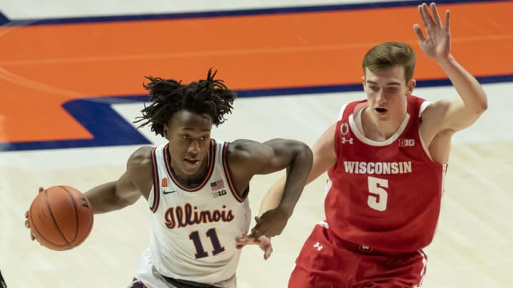 Feb 6, 2021; Champaign, Illinois, USA; Illinois Fighting Illini guard Ayo Dosunmu (11) drives against Wisconsin Badgers forward Tyler Wahl (5) during the first half at State Farm Center. Mandatory Credit: Patrick Gorski-USA TODAY Sports