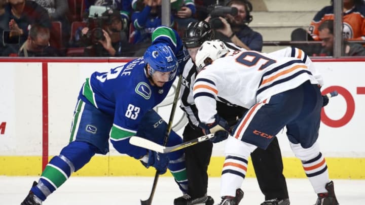 VANCOUVER, BC - DECEMBER 17: Connor McDavid #97 of the Edmonton Oilers and Jay Beagle #83 of the Vancouver Canucks line up for a face-off during their NHL game at Rogers Arena December 17, 2018 in Vancouver, British Columbia, Canada. (Photo by Jeff Vinnick/NHLI via Getty Images)"n