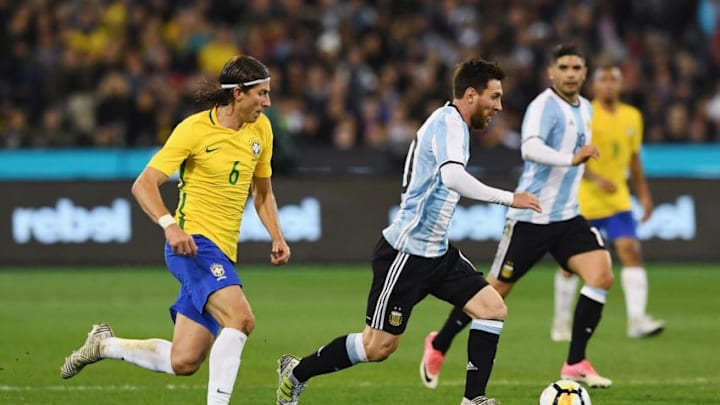 MELBOURNE, AUSTRALIA - JUNE 09: Lionel Messi of Argentina (C) controls fo the ball against Filipe Luis of Brazil during the Brasil Global Tour match between Brazil and Argentina at Melbourne Cricket Ground on June 9, 2017 in Melbourne, Australia. (Photo by Michael Dodge/Getty Images for ICC)
