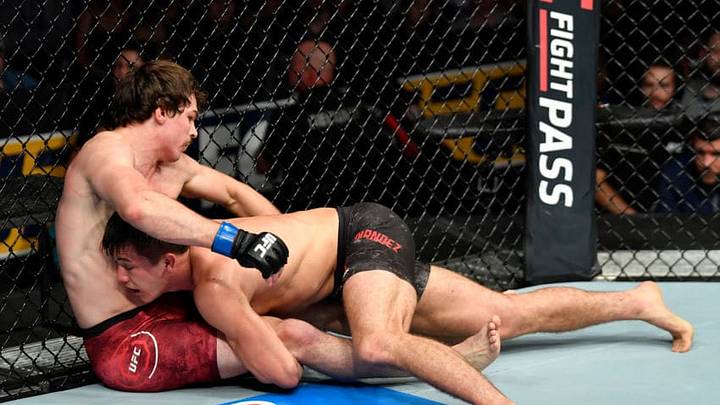 CALGARY, AB - JULY 28: (R-L) Alexander Hernandez takes down Olivier Aubin-Mercier of Canada in their lightweight bout during the UFC Fight Night event at Scotiabank Saddledome on July 28, 2018 in Calgary, Alberta, Canada. (Photo by Jeff Bottari/Zuffa LLC/Zuffa LLC via Getty Images)