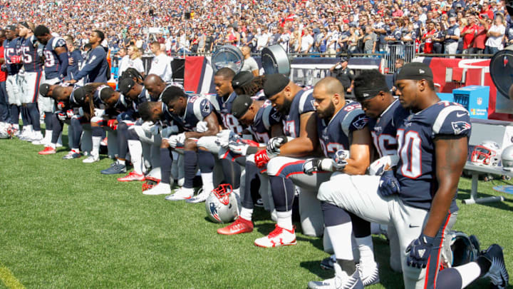 FOXBORO, MA - SEPTEMBER 24: Members of the New England Patriots kneel during the National Anthem before a game against the Houston Texans at Gillette Stadium on September 24, 2017 in Foxboro, Massachusetts. (Photo by Jim Rogash/Getty Images)