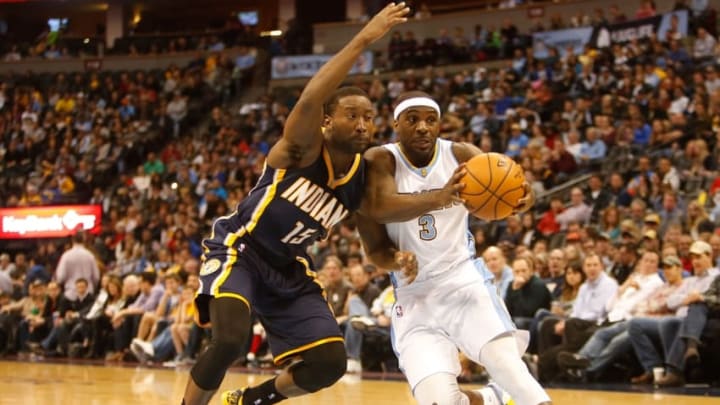 Dec 20, 2014; Denver, CO, USA; Denver Nuggets guard Ty Lawson (3) against Indiana Pacers guard Donald Sloan (15) during the game at Pepsi Center. Mandatory Credit: Chris Humphreys-USA TODAY Sports