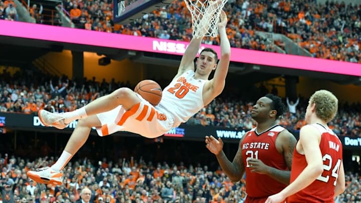 Feb 27, 2016; Syracuse, NY, USA; Syracuse Orange forward Tyler Lydon (20) reacts following a dunk in front of North Carolina State Wolfpack forward BeeJay Anya (21) and guard Maverick Rowan (24) during the second half at the Carrier Dome. Syracuse defeated North Carolina State 75-66. Mandatory Credit: Rich Barnes-USA TODAY Sports