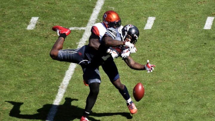 RALEIGH, NC - SEPTEMBER 30: Linebacker Jonathan Thomas #23 of the Syracuse Orange commits pass interference against tight end Jaylen Samuels #1 of the North Carolina State Wolfpack during the football game at Carter Finley Stadium on September 30, 2017 in Raleigh, North Carolina. (Photo by Mike Comer/Getty Images)
