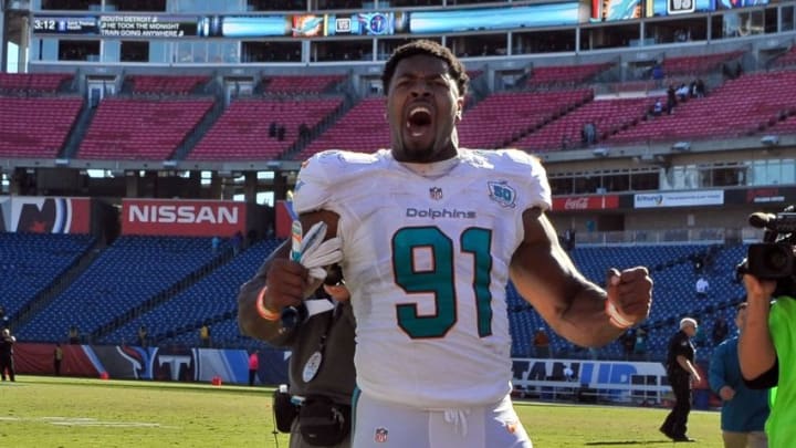 Oct 18, 2015; Nashville, TN, USA; Miami Dolphins defensive end Cameron Wake (91) celebrates as he leaves the field after his team defeated the Tennessee Titans during the second half at Nissan Stadium. Miami won 38-10. Mandatory Credit: Jim Brown-USA TODAY Sports