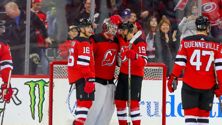 NEWARK, NJ - DECEMBER 29: New Jersey Devils goaltender Mackenzie Blackwood (29) celebrates with teammate after earning his first career shutout after the National Hockey League game between the New Jersey Devils and the Carolina Hurricanes on December 29, 2018 at the Prudential Center in Newark, NJ. (Photo by Rich Graessle/Icon Sportswire via Getty Images)