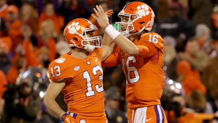 CLEMSON, SC - NOVEMBER 24: Teammates Hunter Renfrow #13 and Trevor Lawrence #16 of the Clemson Tigers react after a play against the South Carolina Gamecocks during their game at Clemson Memorial Stadium on November 24, 2018 in Clemson, South Carolina. (Photo by Streeter Lecka/Getty Images)