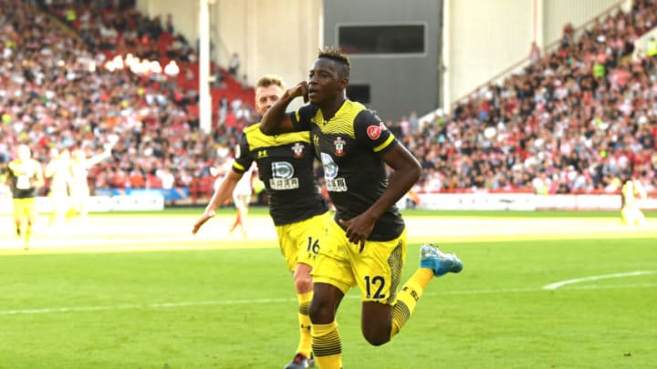 SHEFFIELD, ENGLAND - SEPTEMBER 14: Moussa Djenepo of Southampton celebrates after scoring his team's first goal during the Premier League match between Sheffield United and Southampton FC at Bramall Lane on September 14, 2019 in Sheffield, United Kingdom. (Photo by Ross Kinnaird/Getty Images)