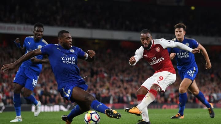 LONDON, ENGLAND - AUGUST 11: Alexandre Lacazette of Arsenal shoots on goal as Wes Morgan of Leicester City closes in during the Premier League match between Arsenal and Leicester City at the Emirates Stadium on August 11, 2017 in London, England. (Photo by Shaun Botterill/Getty Images)