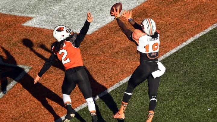 Jan 24, 2015; Mobile, AL, USA; South squad wide receiver Sammie Coates of Auburn (18) tries to hang onto a pass over North squad defensive corner Steven Nelson of Oregon State (2) during the first quarter of the Senior Bowl at Ladd-Peebles Stadium. Mandatory Credit: John David Mercer-USA TODAY Sports