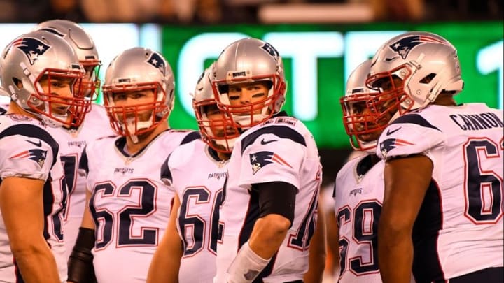 Nov 27, 2016; East Rutherford, NJ, USA; New England Patriots quarterback Tom Brady (12) and teammates look on during the first half against the New York Jets at MetLife Stadium. Mandatory Credit: Robert Deutsch-USA TODAY Sports