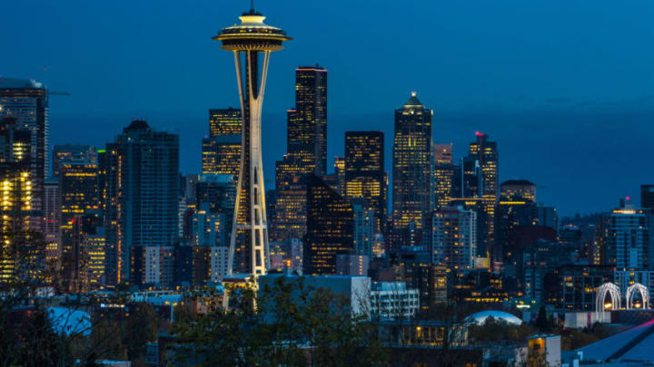 SEATTLE, WA - NOVEMBER 4: The sun sets on the Space Needle and downtown skyline as viewed at dusk on November 4, 2015, in Seattle, Washington. Seattle, located in King County, is the largest city in the Pacific Northwest, and is experiencing an economic boom as a result of its European and Asian global business connections. (Photo by George Rose/Getty Images)