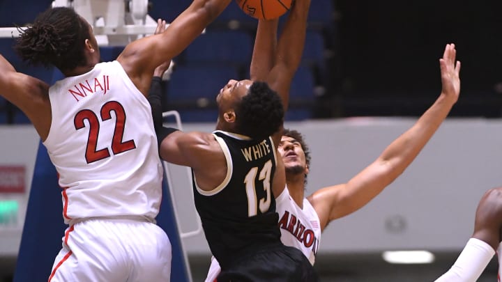 ANAHEIM, CA – DECEMBER 01: Zeke Nnaji #22 and Chase Jeter #4 of the Arizona Wildcats block a shot by Andrien White #13 of the Wake Forest Demon Deacons in the first half of the game during the Wooden Legacy at the Anaheim Convention Center at on December 1, 2019 in Anaheim, California. (Photo by Jayne Kamin-Oncea/Getty Images)