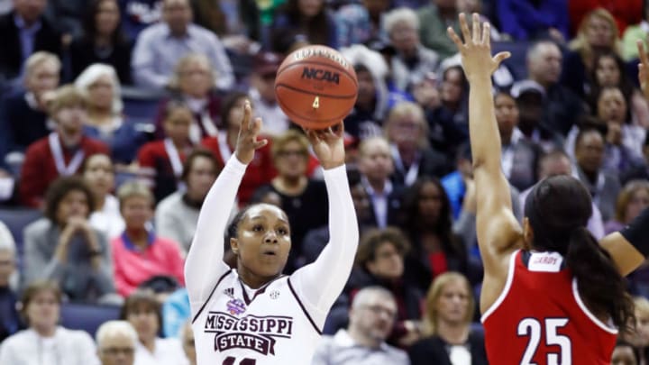 COLUMBUS, OH - MARCH 30: Roshunda Johnson #11 of the Mississippi State Lady Bulldogs attempts a shot defended by Asia Durr #25 of the Louisville Cardinals during the first half in the semifinals of the 2018 NCAA Women's Final Four at Nationwide Arena on March 30, 2018 in Columbus, Ohio. (Photo by Andy Lyons/Getty Images)