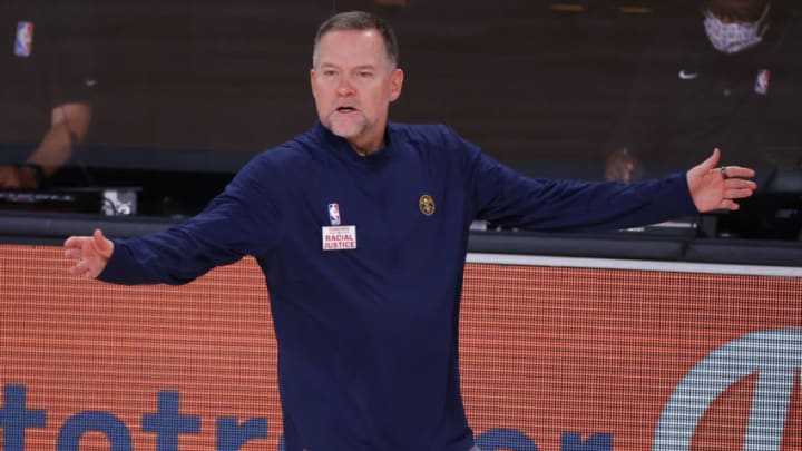 LAKE BUENA VISTA, FLORIDA - AUGUST 23: Michael Malone of the Denver Nuggets argues against the Utah Jazz during the third quarter in Game Four of the Western Conference First Round during the 2020 NBA Playoffs at AdventHealth Arena at ESPN Wide World Of Sports Complex on August 23, 2020 in Lake Buena Vista, Florida. NOTE TO USER: User expressly acknowledges and agrees that, by downloading and or using this photograph, User is consenting to the terms and conditions of the Getty Images License Agreement. (Photo by Kevin C. Cox/Getty Images)
